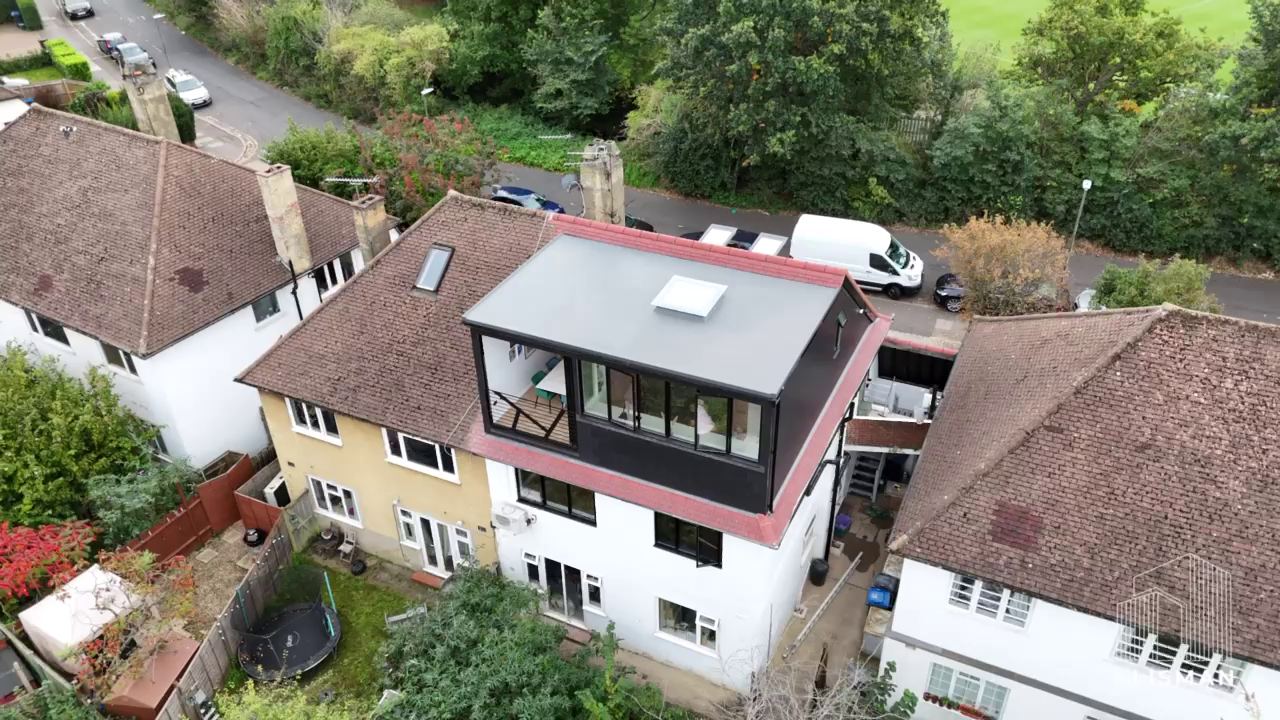 Aerial view of the house with the new glazed top floor