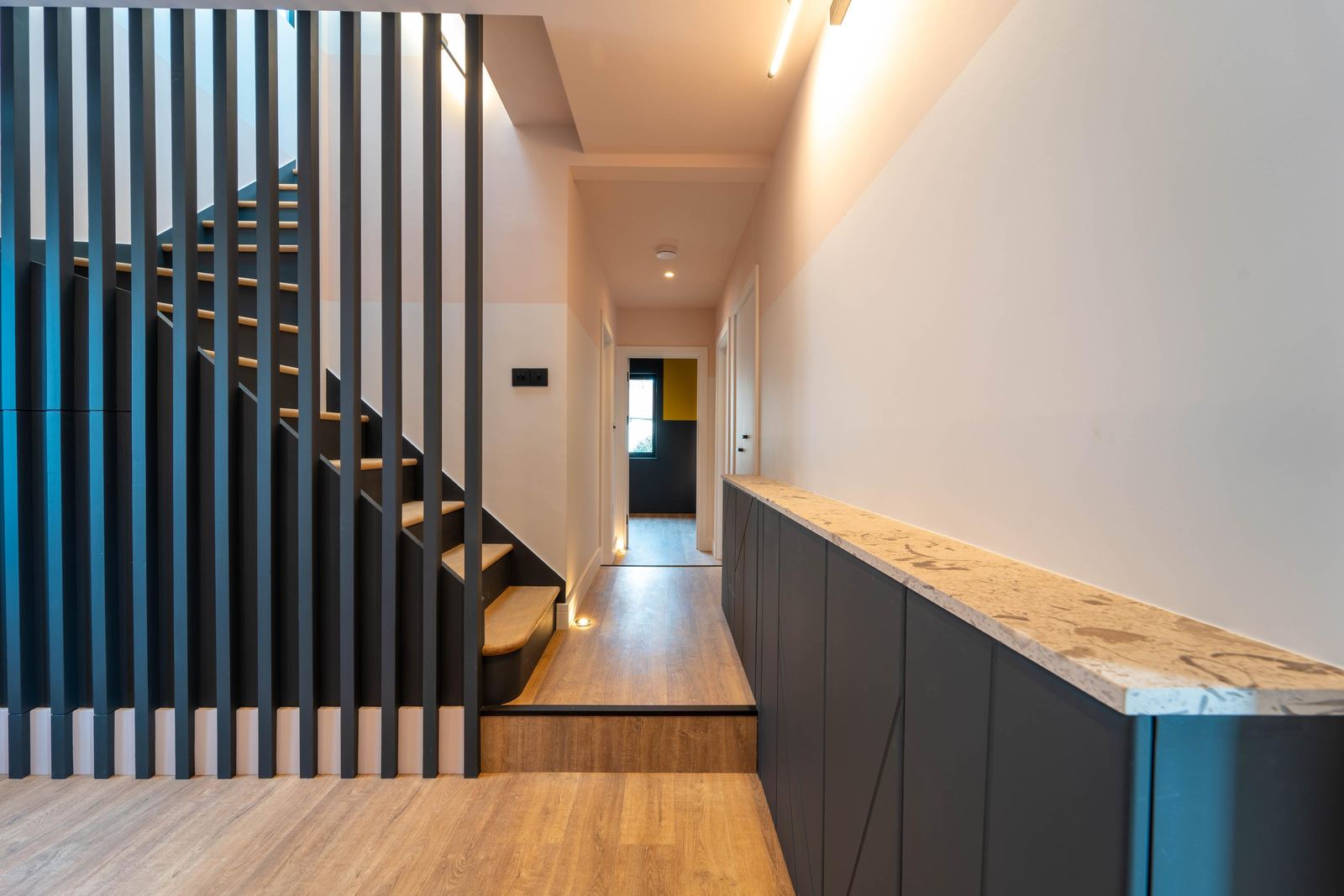Hallway with a slatted timber screen beside the staircase